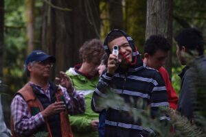 Students used a relascope and mad math skills to calculate tree height. Photo by Caitlin Battersby.