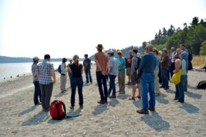 Rebecca Benjamin, Executive Director of North Olympic Salmon Coalition, presents on her work with Chumsortium partners on preservation and restoration efforts in the Chimacum Creek Estuary.