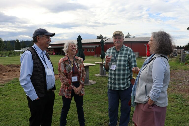 Photo of four people on the lawn at Finnriver Farm & Cidery