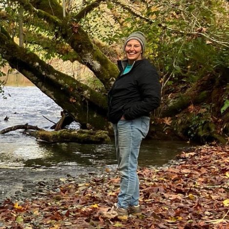 Woman on riverbank