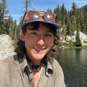 Smiling woman by lake