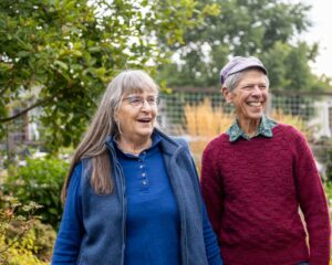 Smiling man and woman in garden